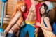 A group of people dressed up as anime characters posing for a picture.