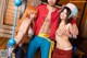 A group of three people dressed up as anime characters.